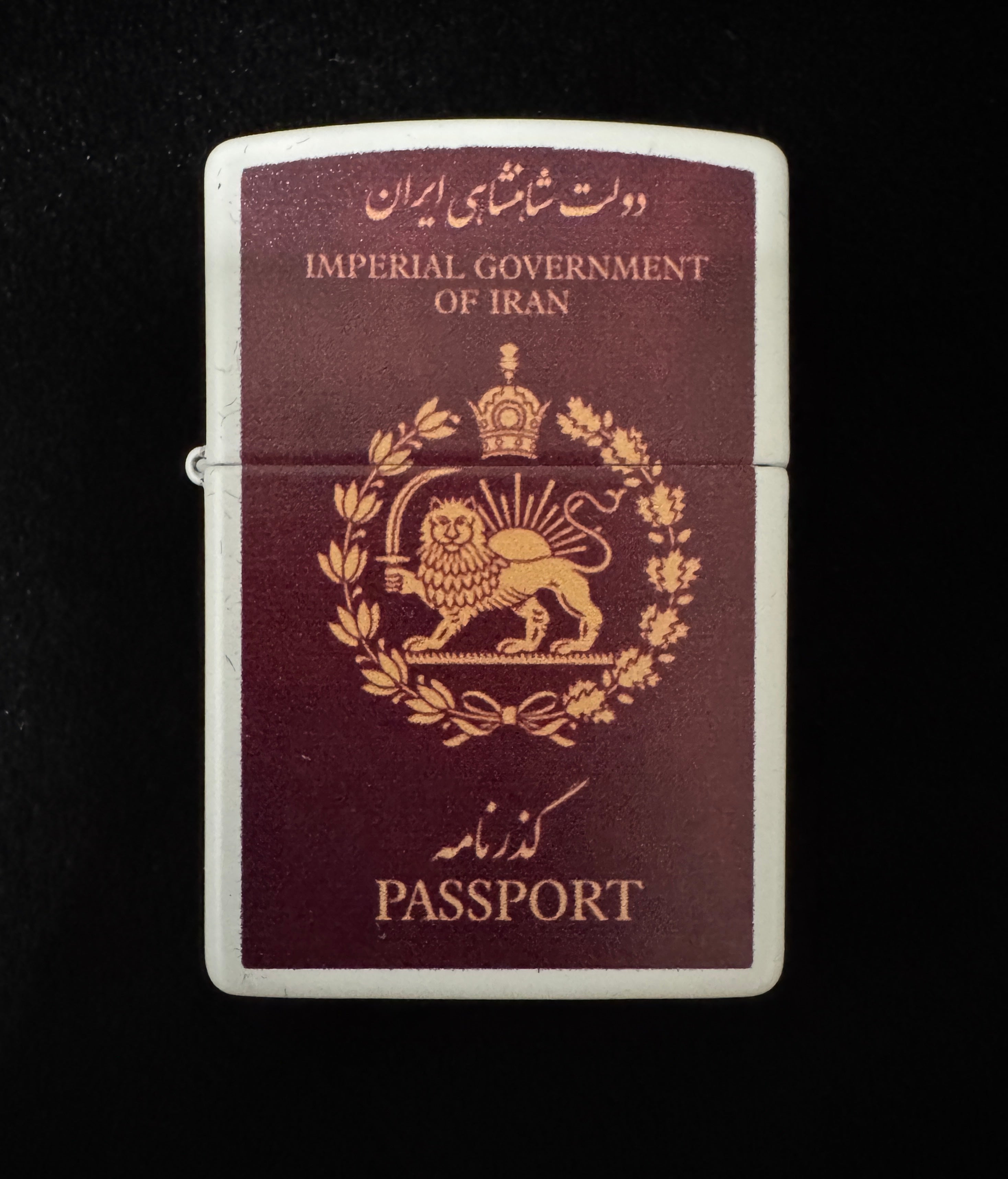 White lighter with Imperial Government of Iran passport design, Lion and Sun emblem, and Pahlavi Crown on black background